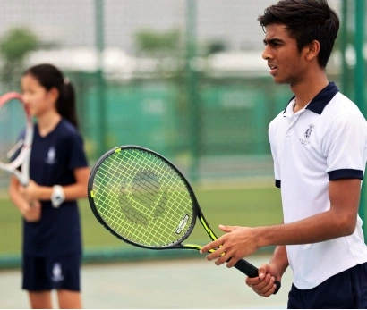 Students playing tennis